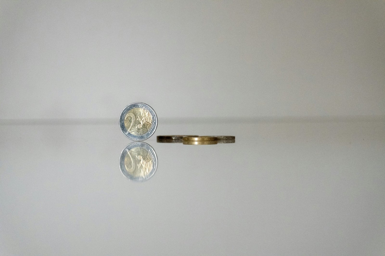 a gold ring with a gold ring with a coin on top of it